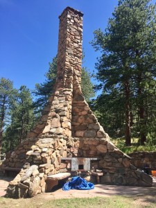 The chimney with deteriorated stone & mortar in 2018, before HistoriCorps' work.